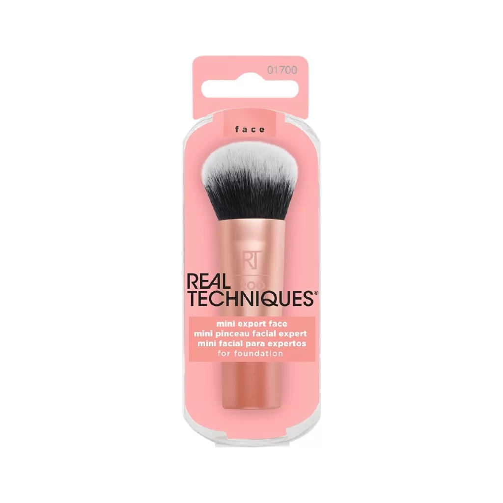 Real Techniques Mini Expert Face Brush - a compact makeup brush on a white background