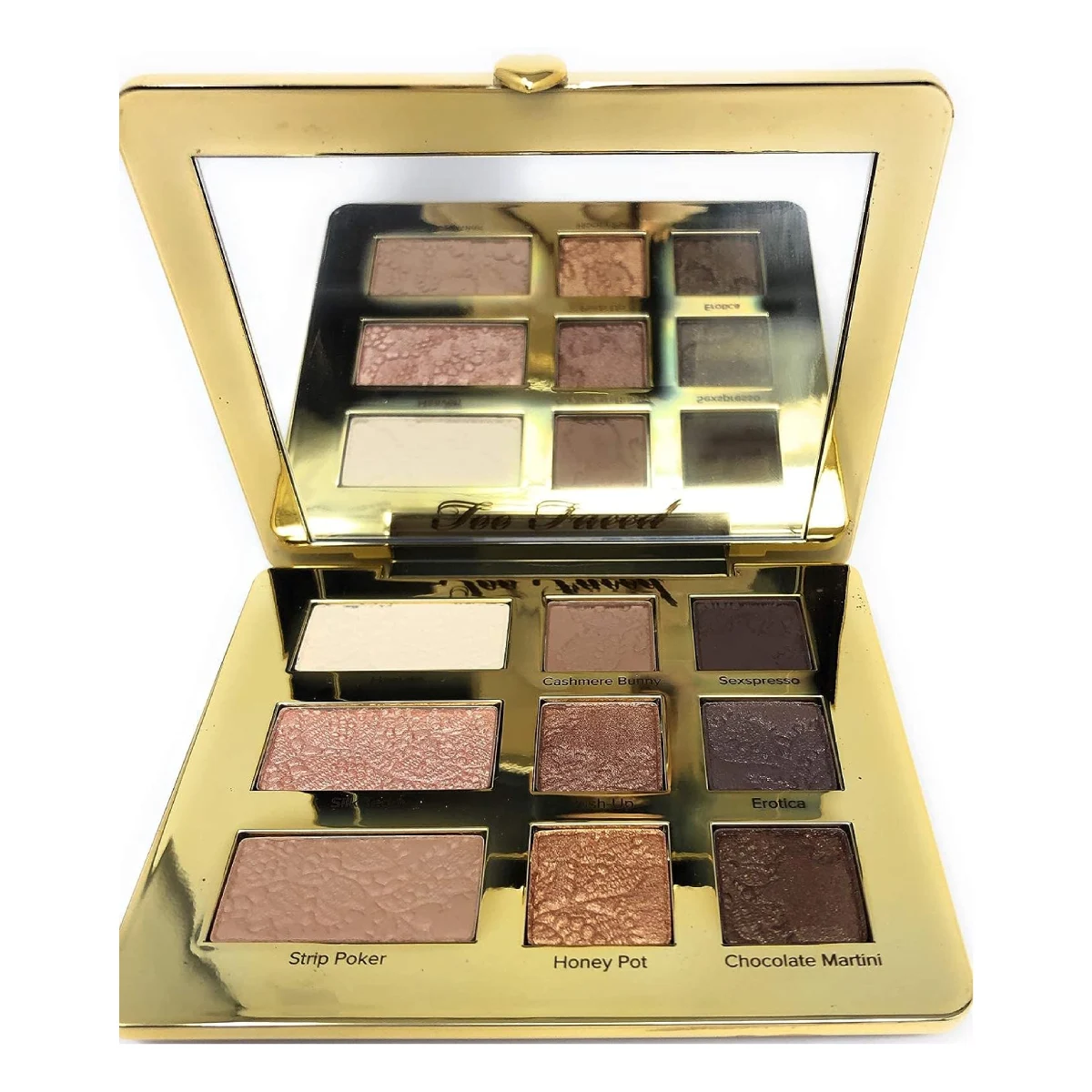 Open Too Faced Natural Eyes Eyeshadow Palette against a white background, showcasing a range of neutral shades from light beige to deep brown.
