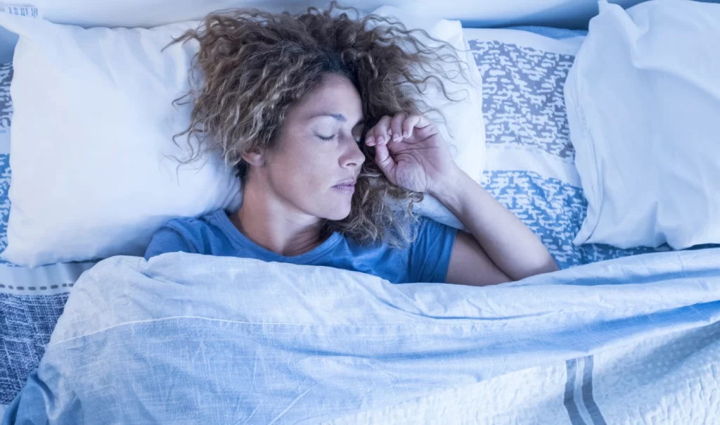 Sleeping woman, demonstrating the relationship between sleep and even skin tone