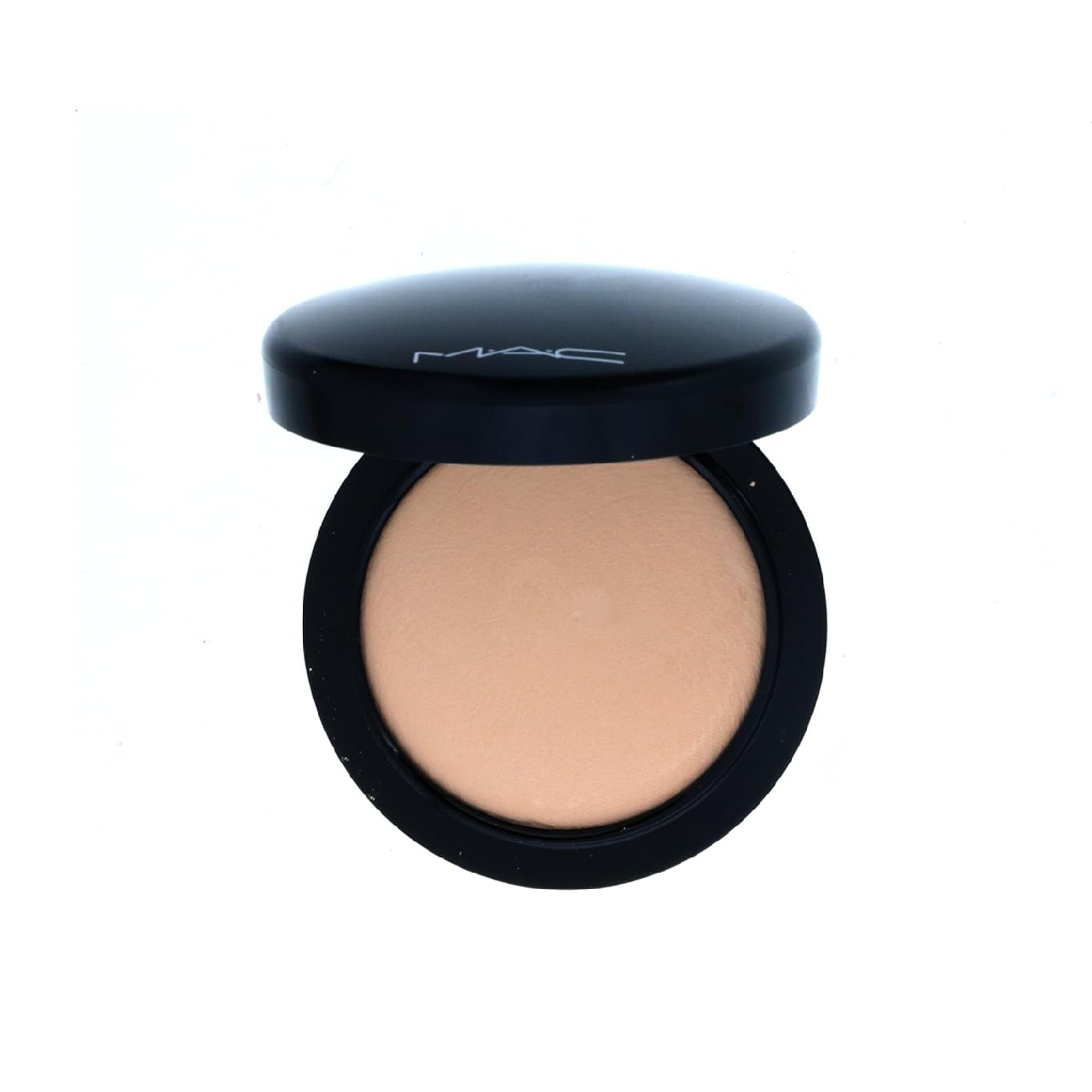 Open compact of MAC Mineralize Skinfinish highlighter on a white background, showcasing its baked, marbled texture.