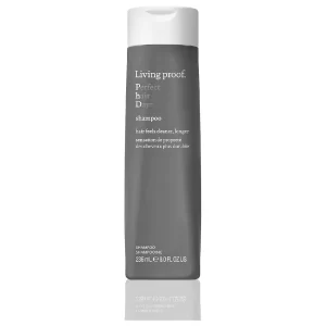 Bottle of Living Proof Perfect Hair Day Shampoo on a white background